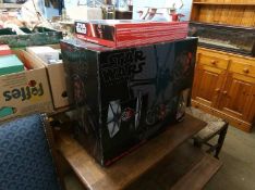 A boxed Star Wars 'First Order Special Forces Tie Fighter' and a boxed remote control Millennium