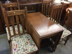 Oak gateleg table and four chairs