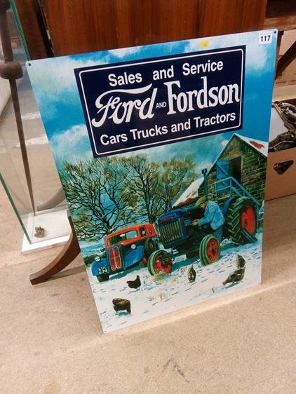 A metal advertising sign 'Sales and Service Ford and Fordson Car Trucks and Tractors'