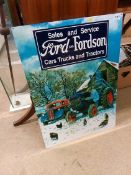 A metal advertising sign 'Sales and Service Ford and Fordson Car Trucks and Tractors'