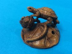 Netsuke; turtle on a lily leaf