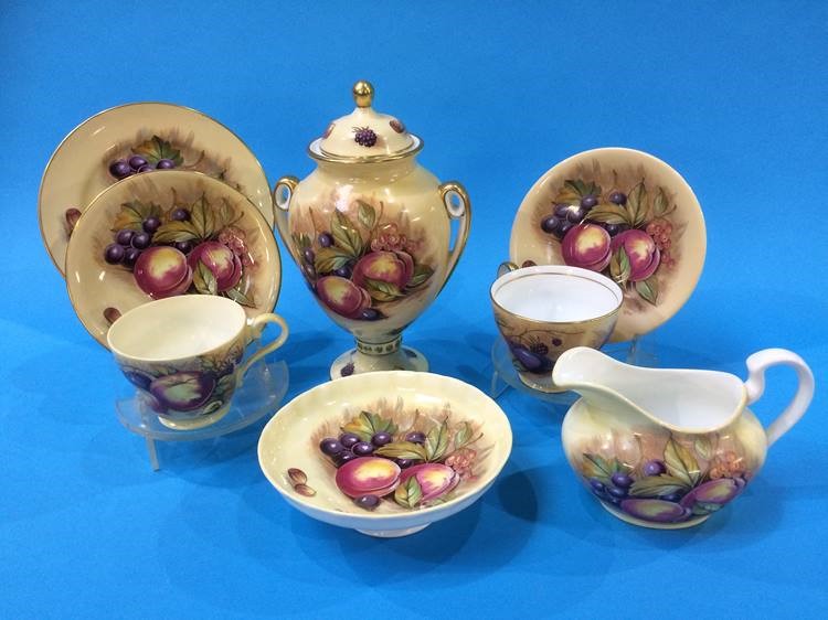 An Aynsley two handled vase decorated with fruit and six side plates, cream jug etc.