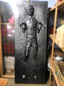 A full scale model of Han Solo frozen in carbonite (lights up and with remote control)