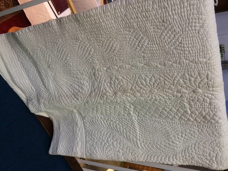 A cream Durham quilt