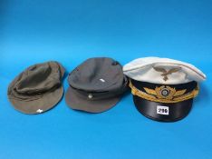 Three German military hats