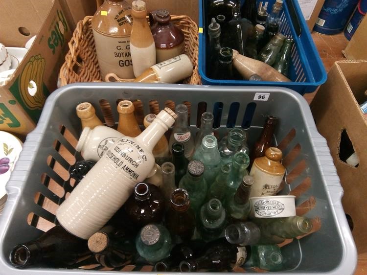 Three boxes of pottery and glass advertising bottles