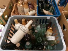 Three boxes of pottery and glass advertising bottles