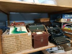 A shelf of assorted, including 'Royal' typewriter, 'Admica 8' cine camera etc.