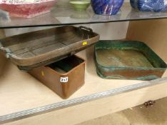 A garden trug and two copper vessels