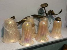 A set of five Serpentine metal work wall sconces and pink shades