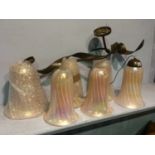 A set of five Serpentine metal work wall sconces and pink shades