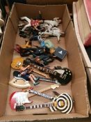 A box of Elvis figures and guitars