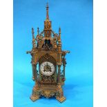 A 19th century gilt metal bracket clock of Gothic form, with eight day movement, enamelled dial,