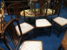 A set of four Edwardian mahogany single chairs