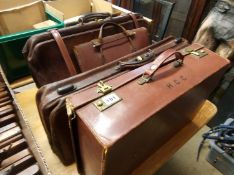 Four leather bags, includes suitcase