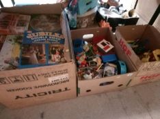 Three boxes of toys and puzzles