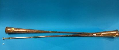 A pair of copper hunting horns, stamped London and York, George III, 123cm length