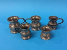 Five pewter measures