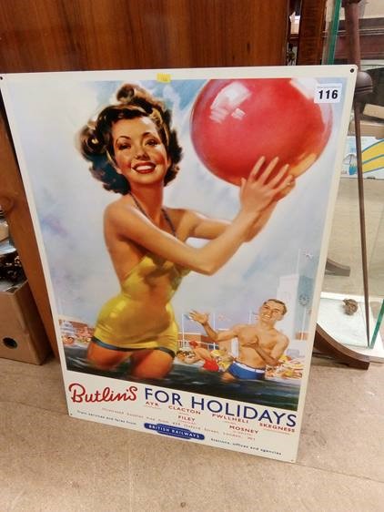 A metal advertising sign, 'Butlins For Holidays'