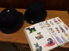 Two bowler hats and a scrap book