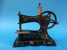 A miniature child's sewing machine