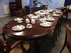 Good quality reproduction mahogany extending dining table, four leaves, four single chairs and