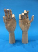 A pair of articulated wooden hands