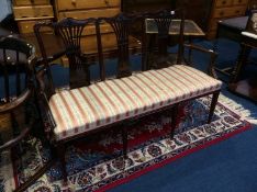 A mahogany three seater window seat