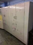 An E-Gomme G plan bedroom suite, decorated with flowers, comprising two wardrobes, chest of