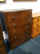 Oak bow front chest of drawers