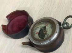 A compass with leather case