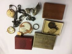 A silver Albert, various fobs, a cameo etc.