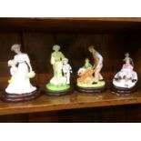 Four Coalport figure groups