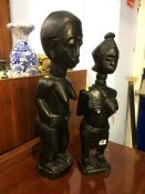 Pair of African style figures and five crosses