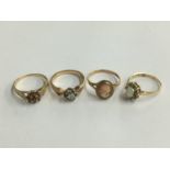 Four gold dress rings