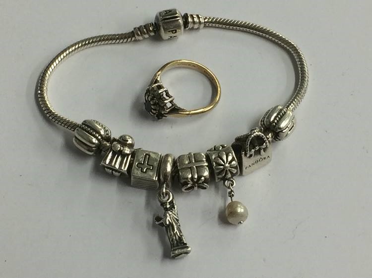 A Pandora style bracelet and a ring