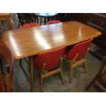 An Ercol table with four chairs