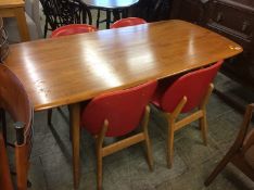 An Ercol table with four chairs