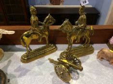 Pair of brass door stops and a cannon