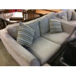 A pair of two seater settees and a footstool