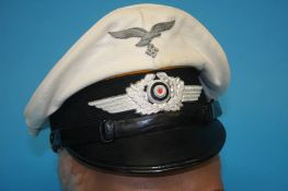 A Luftwaffe flight Non-Commissioned Officer (NCO), white top visor cap, stamped Ludwig Worz,