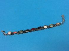 An Indian silver coloured bracelet mounted with semi precious stones