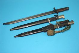 Two long pattern bayonets one stamped A. Evertz and the other W.K.C. and another bayonet (3)