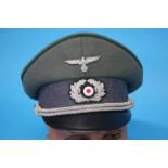 A German Wehrmacht Beamte (Army Administration) Officer's visor cap, stamped Pekuro, by Peter