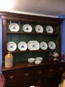 A 19th century pine dresser with raised plate rack, below four drawers and two cupboard doors, 168cm