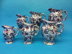 Two sets of three graduated Maling Chintz jugs