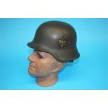 A World War II German single decal Kriegsmarine tin helmet, numbered 2438 and E162