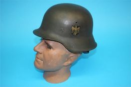 A World War II German single decal Kriegsmarine tin helmet, numbered 2438 and E162