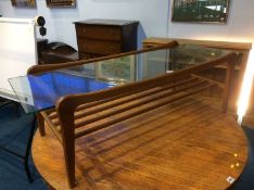 A teak and glass top coffee table