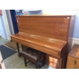 A Steinway and Sons 'Model K' Upright piano, in a walnut veneered high gloss (polyester) finish,